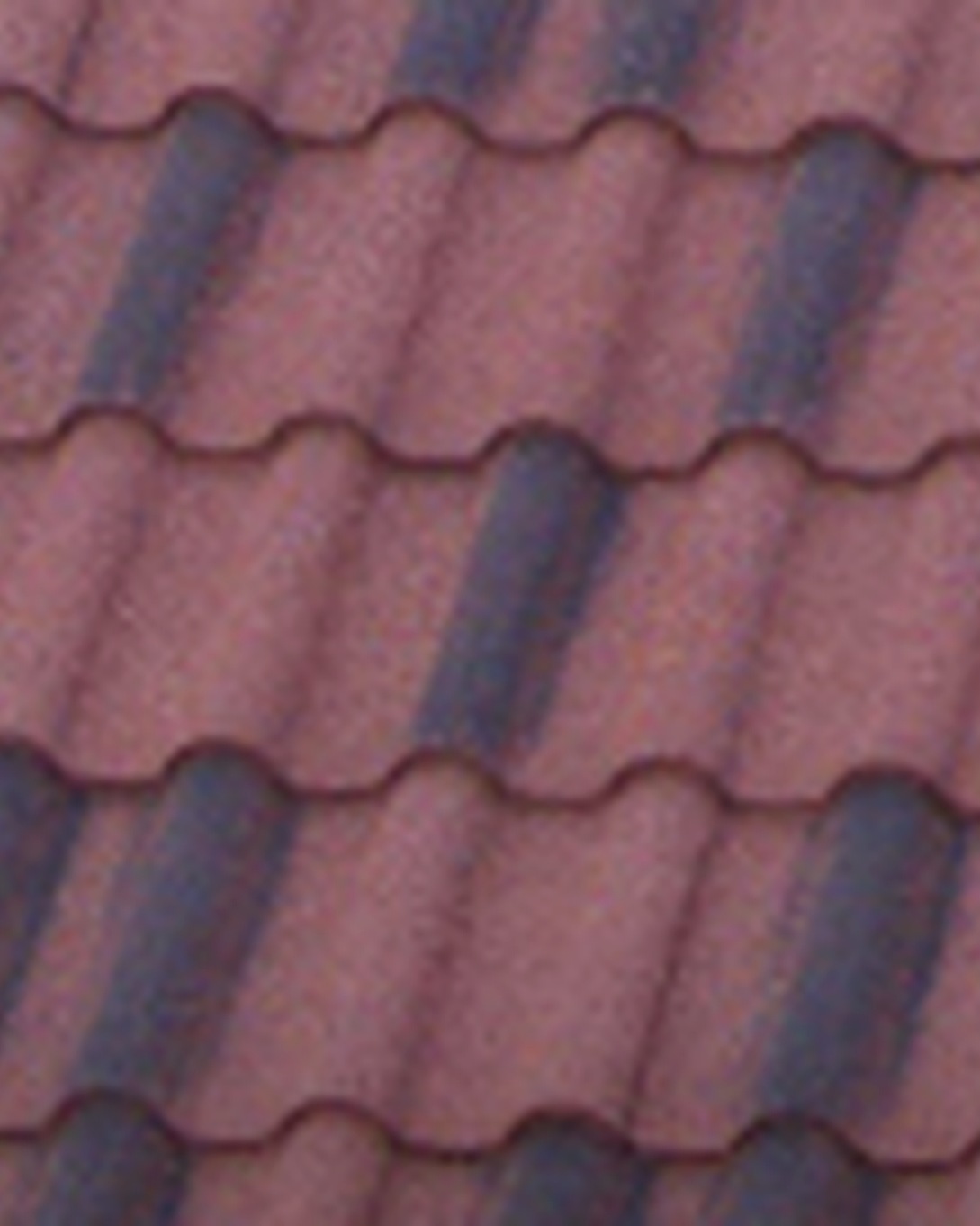 Close-up of DECRA Villa Tile stone-coated steel roofing in scalloped Mediterranean profile