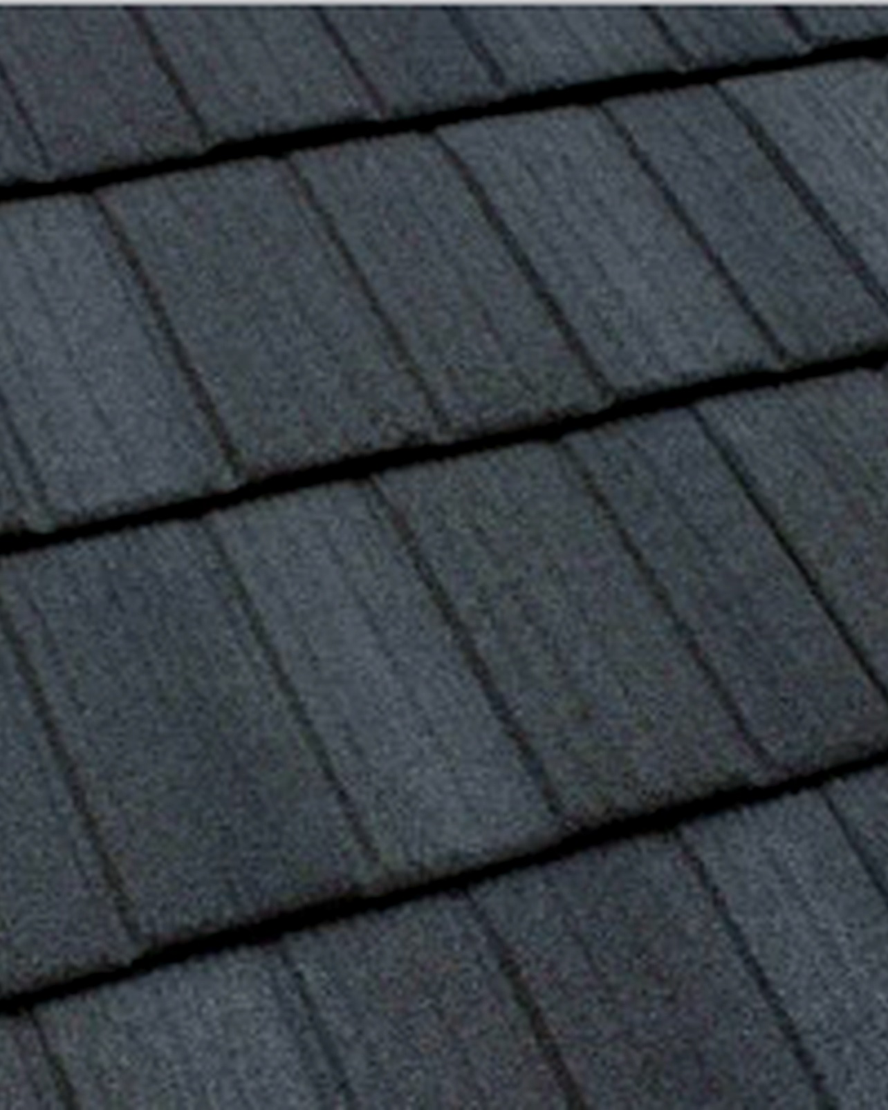 Close-up of Tilcor CF Shake stone-coated steel stamped with deep vertical wood-grain split cedar shake texture